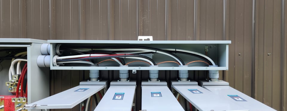 Conduit runs feeding a commercial panel bank