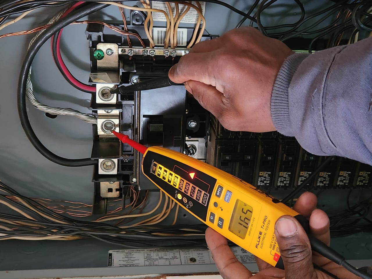 3D Electric technician testing a panel with a multimeter